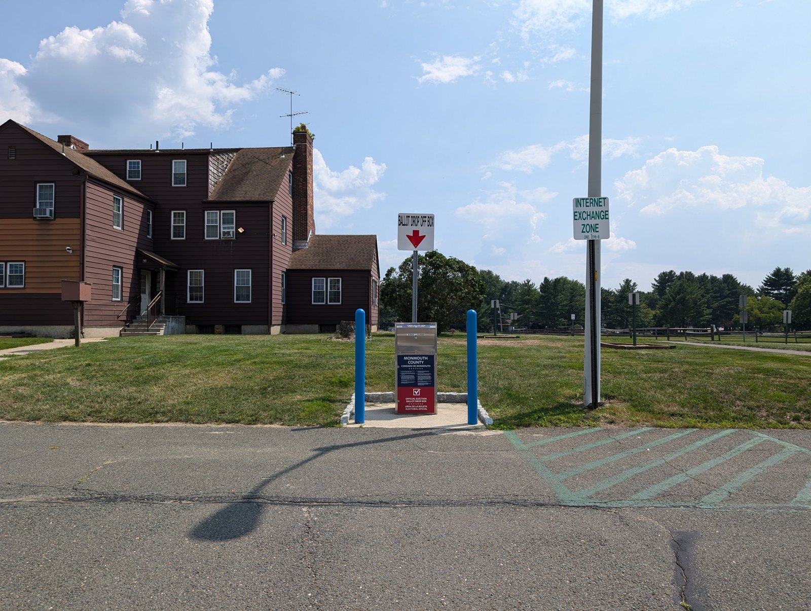 A Monmouth County secure ballot drop box under a Ballot Drop Off Box sign outside the Marlboro Township municipal complex.