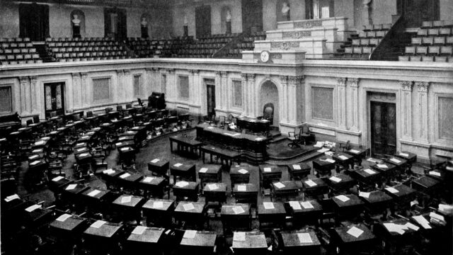 The empty U.S. Senate chamber in a 1921 black-and-white photograph