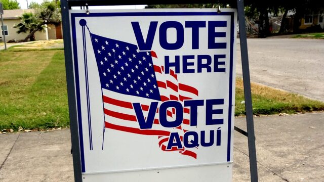 Bilingual Vote Here sign outside a polling place in Taft, Texas.